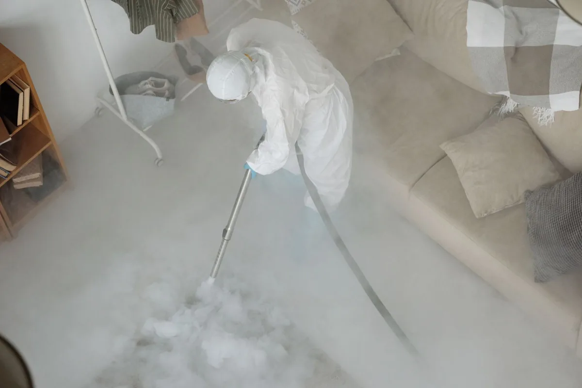 Biohazard cleanup technician in protective equipment, Von Ormy, TX